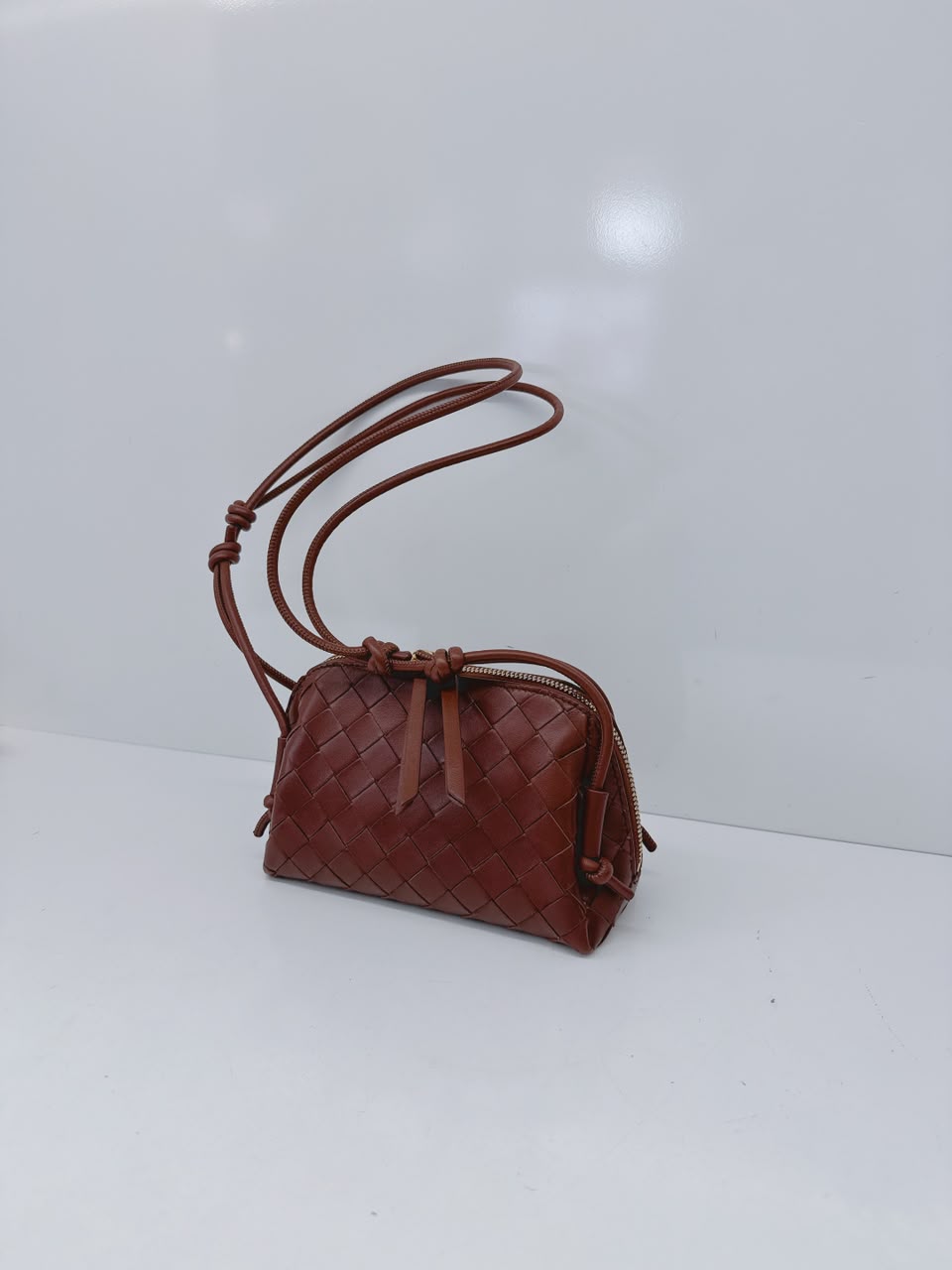 BROWN INTRECCIATO LEATHER MINI CONCERT POUCH