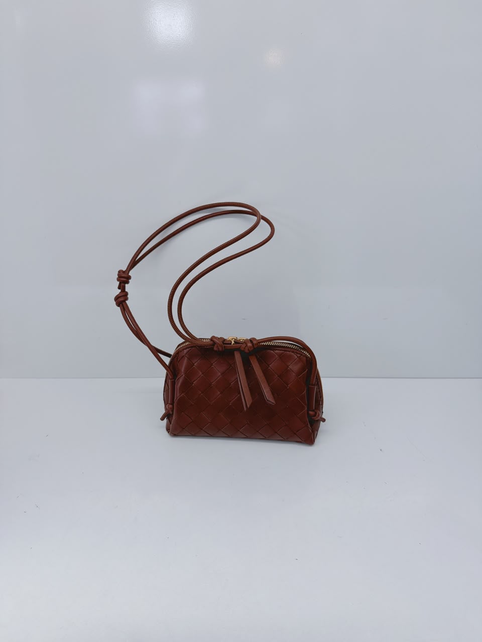 BROWN INTRECCIATO LEATHER MINI CONCERT POUCH