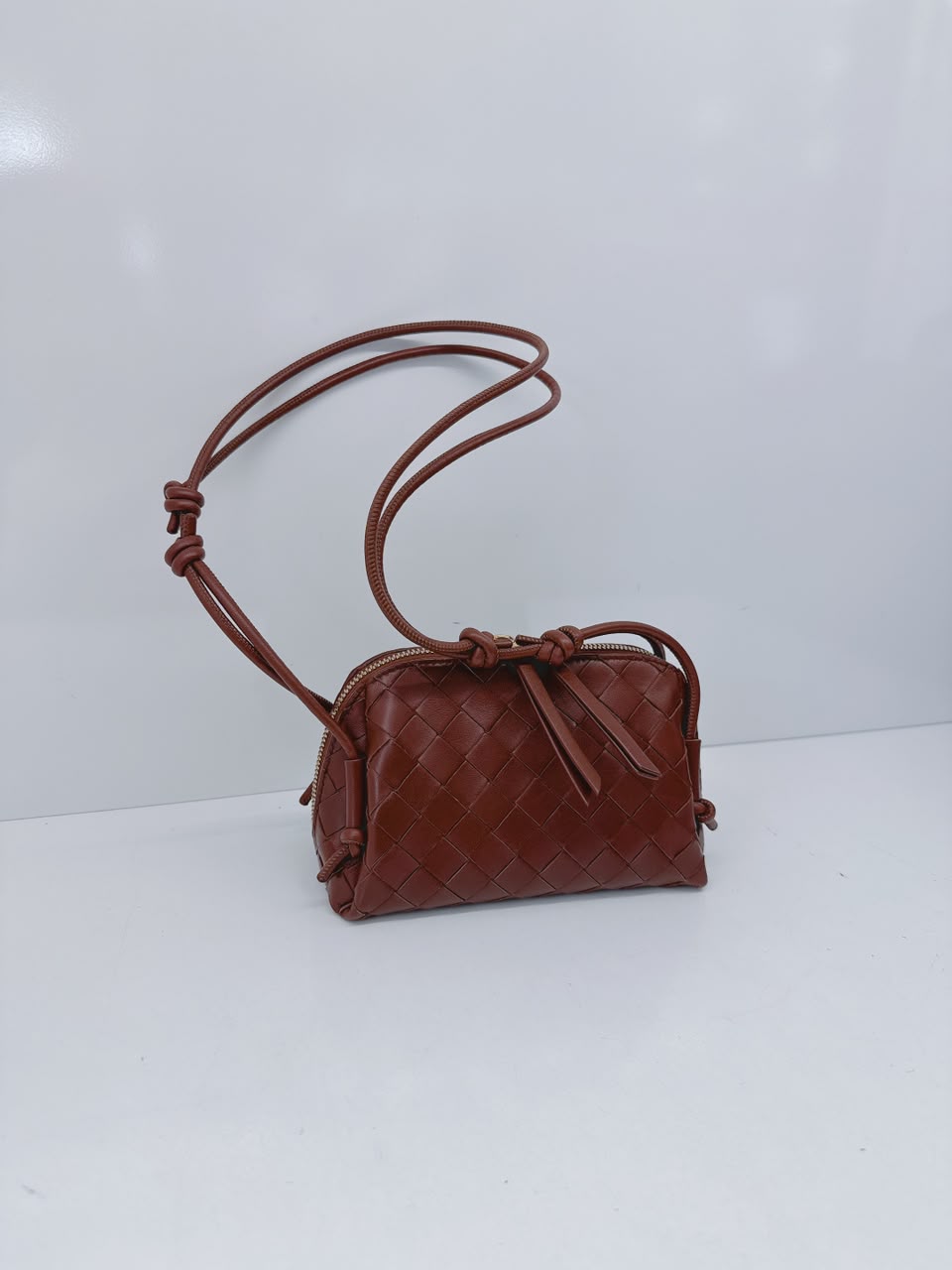 BROWN INTRECCIATO LEATHER MINI CONCERT POUCH