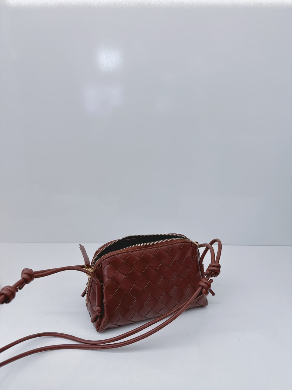 BROWN INTRECCIATO LEATHER MINI CONCERT POUCH