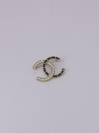 CC LOGO CRYSTAL AND LEATHER CHAIN GOLD TONE BROOCH