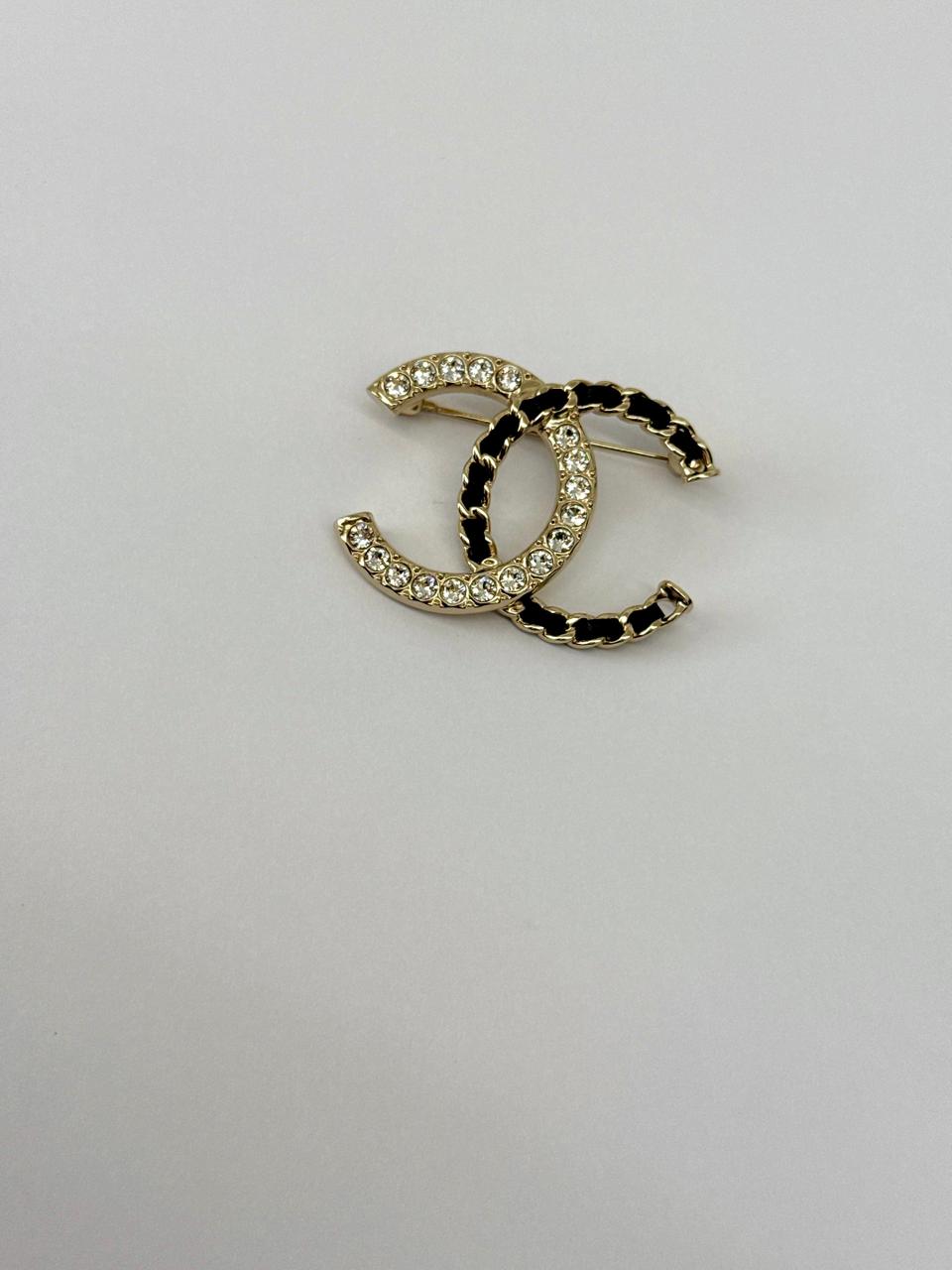 CC LOGO CRYSTAL AND LEATHER CHAIN GOLD TONE BROOCH
