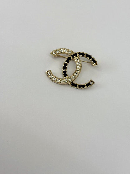 CC LOGO CRYSTAL AND LEATHER CHAIN GOLD TONE BROOCH