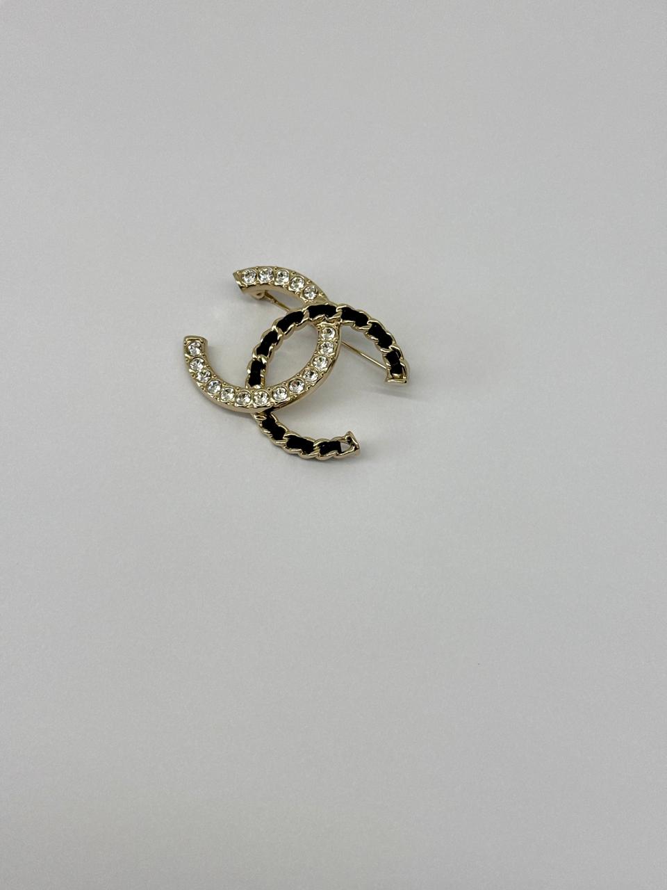 CC LOGO CRYSTAL AND LEATHER CHAIN GOLD TONE BROOCH