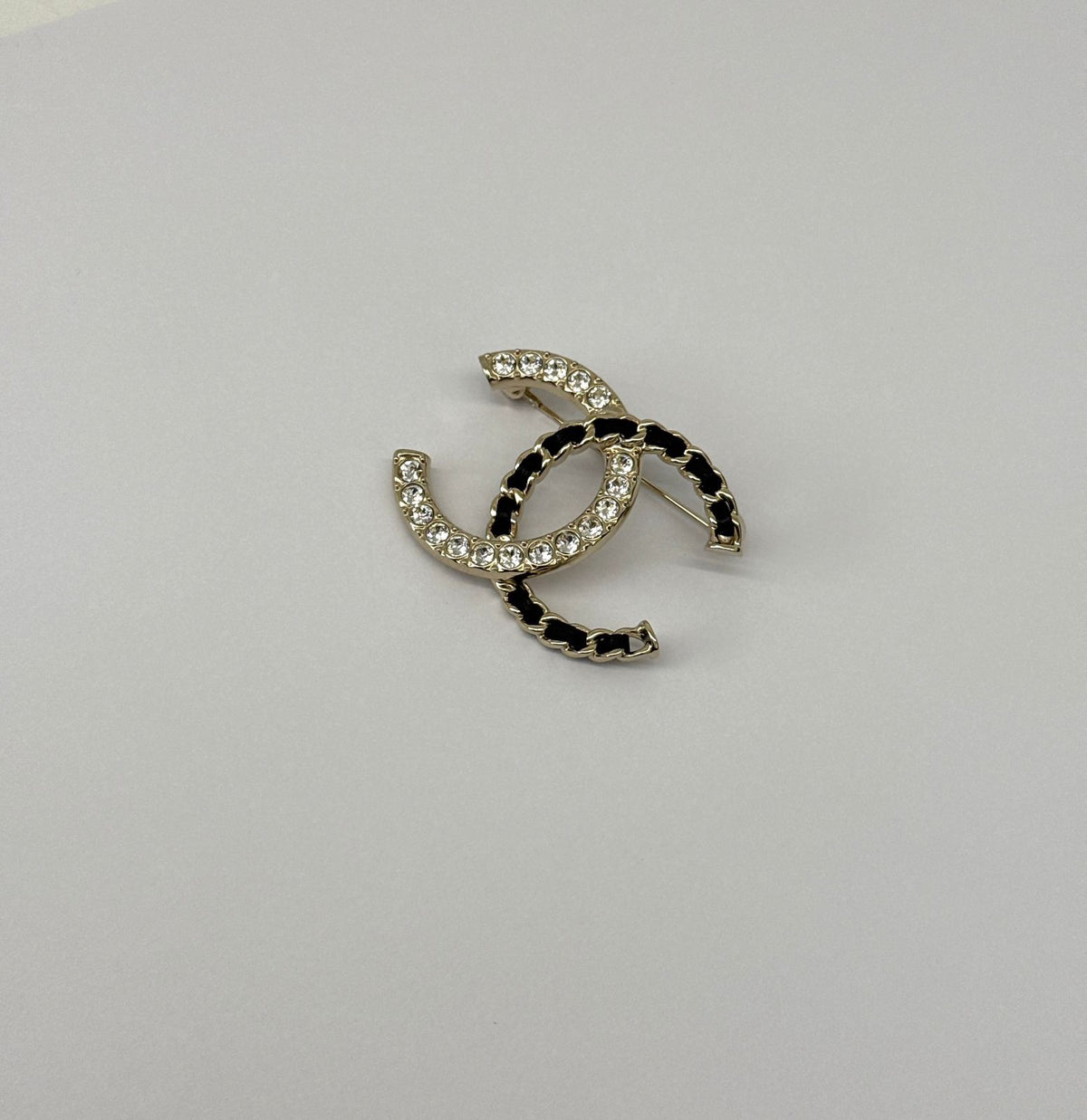 CC LOGO CRYSTAL AND LEATHER CHAIN GOLD TONE BROOCH