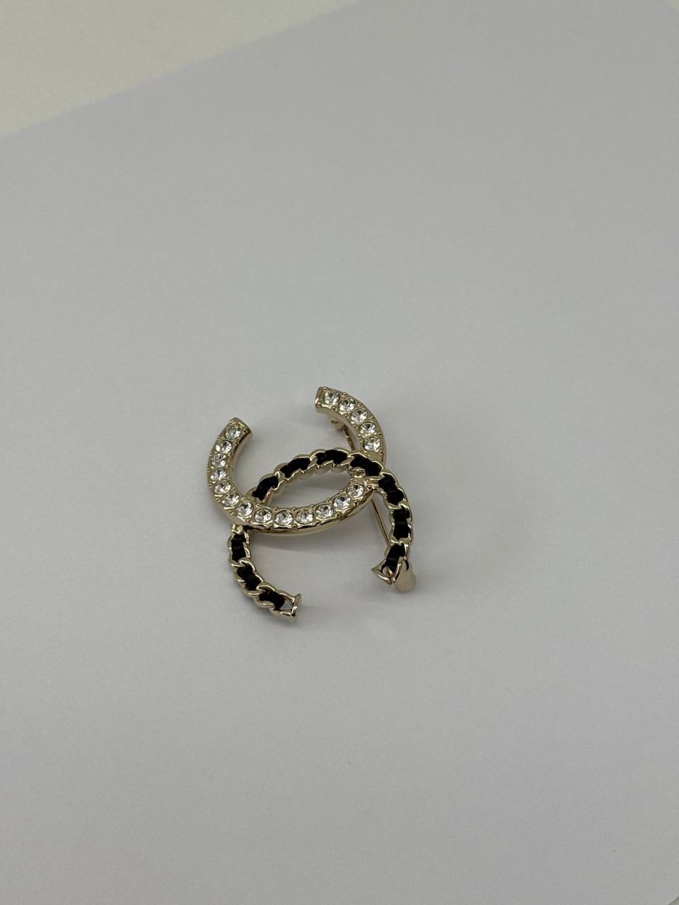 CC LOGO CRYSTAL AND LEATHER CHAIN GOLD TONE BROOCH