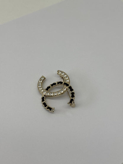 CC LOGO CRYSTAL AND LEATHER CHAIN GOLD TONE BROOCH