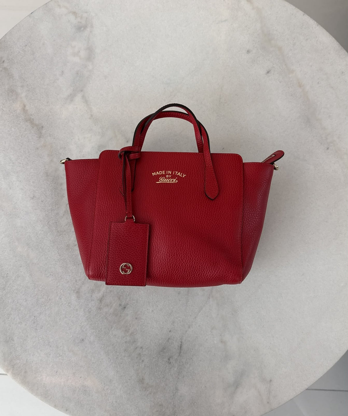 RED LEATHER MINI SWING TOTE BAG