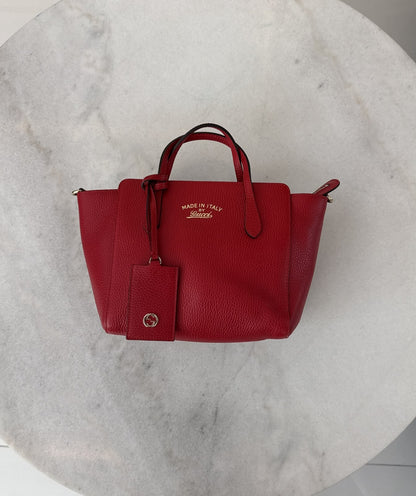 RED LEATHER MINI SWING TOTE BAG