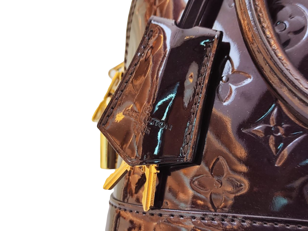 AMARANTE MONOGRAM VERNIS ALMA BB BAG