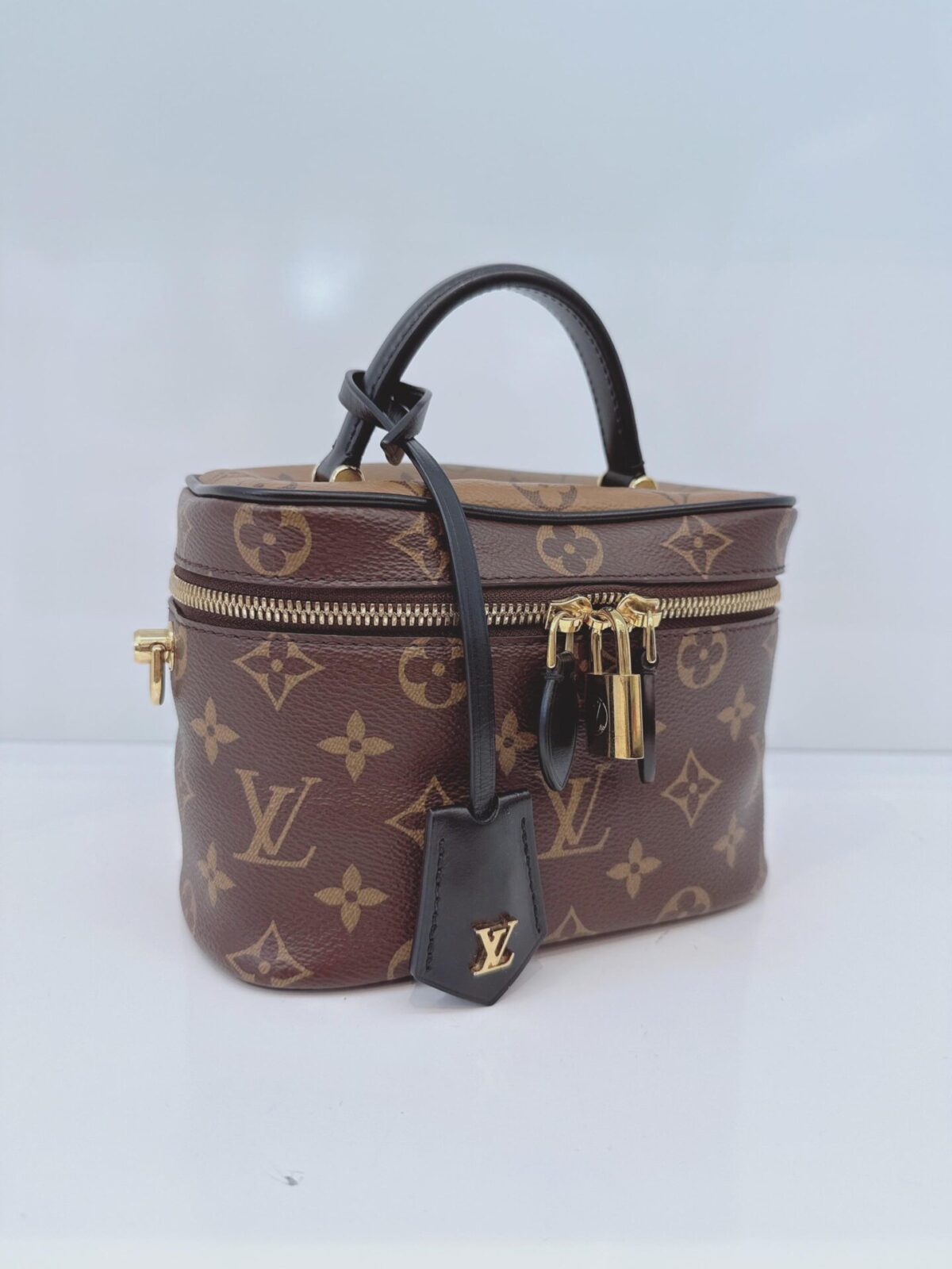 MONOGRAM REVERSE CANVAS VANITY PM  BAG